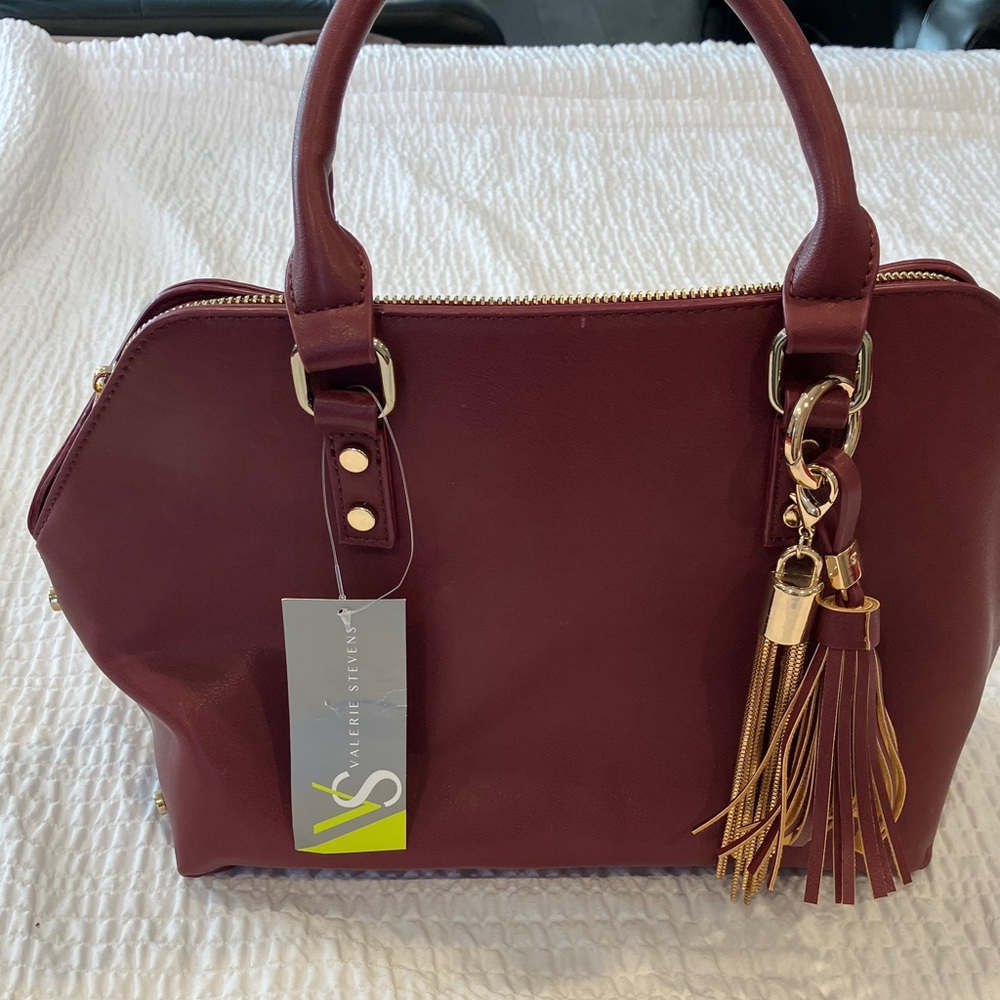 Valerie Steven’s Elegant Burgundy Handbag with Tassels